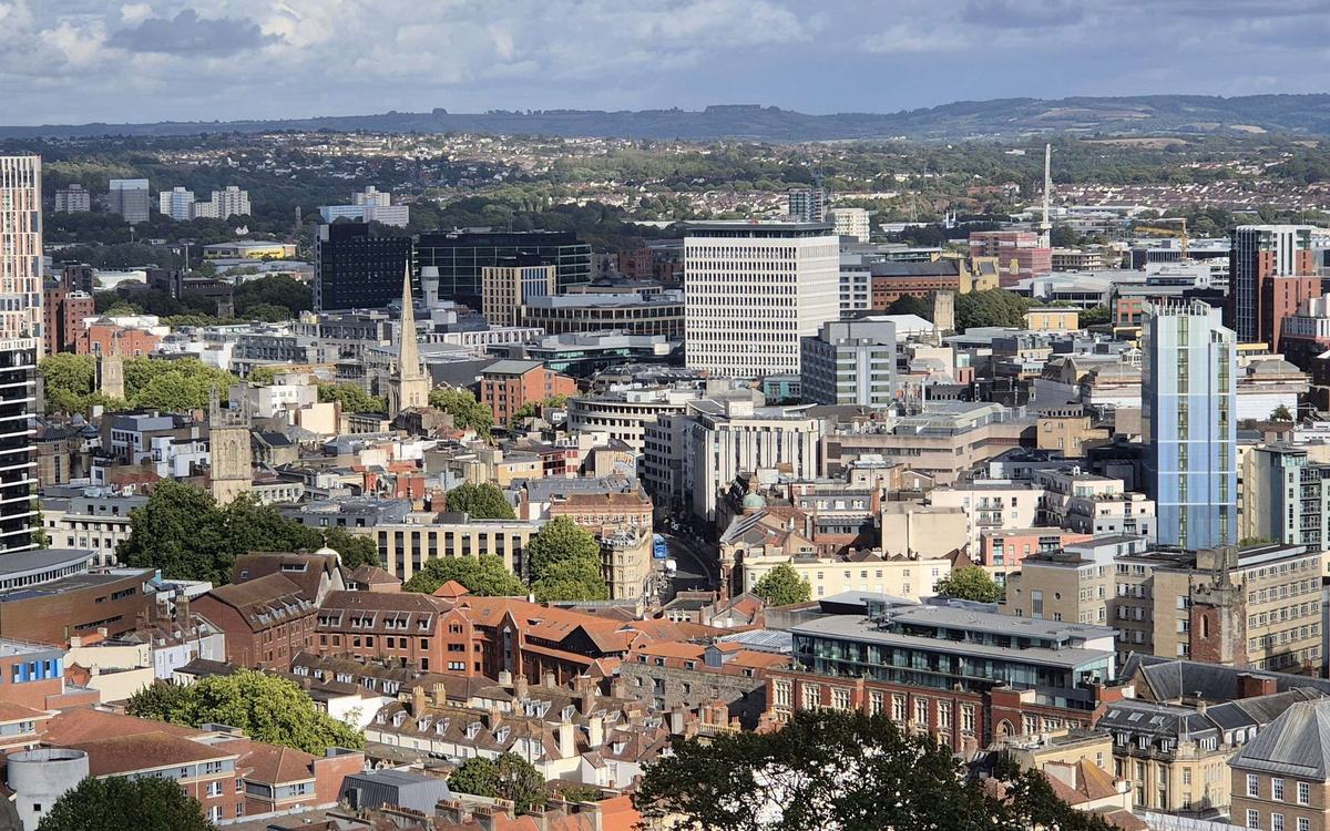 Bristol city centre rooftops, church spires and tower blocks seen from Cabot Tower on a sunny day