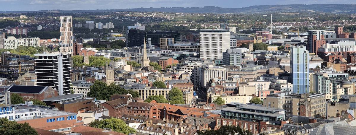 Bristol city centre rooftops, church spires and tower blocks seen from Cabot Tower on a sunny day