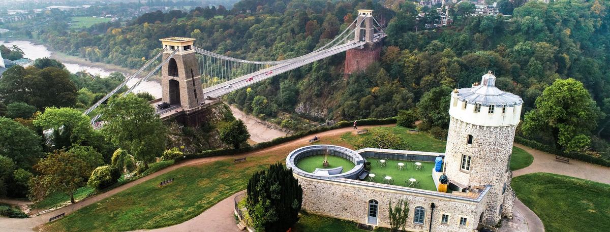 Aerial view of Clifton Suspension Bridge over the Avon Gorge, with Clifton Observatory in the foreground, Bristol
