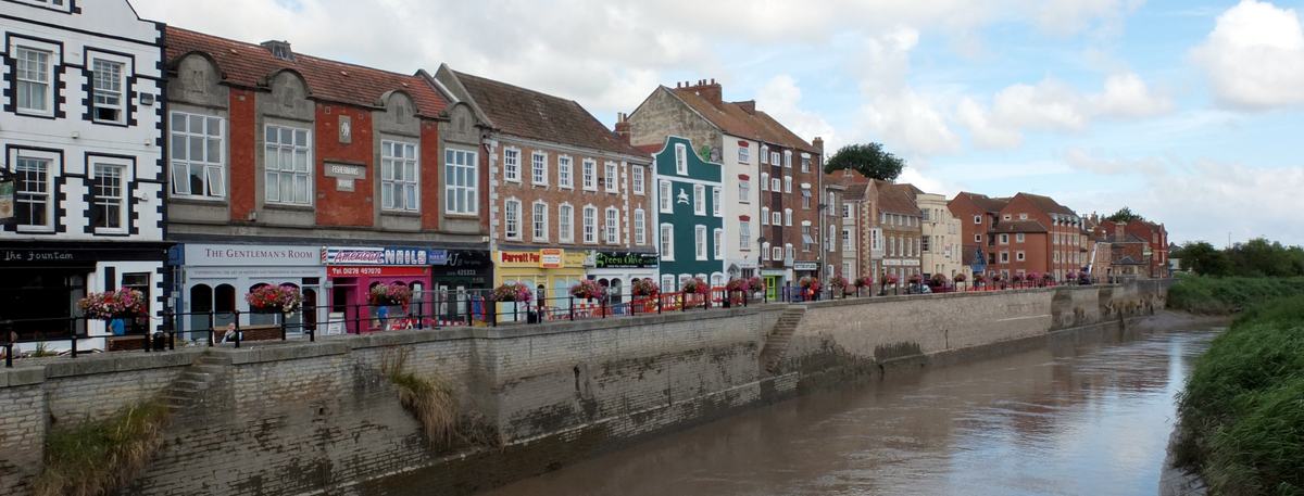Colourful historic buildings along West Quay beside the River Parrett in Bridgwater, Somerset
